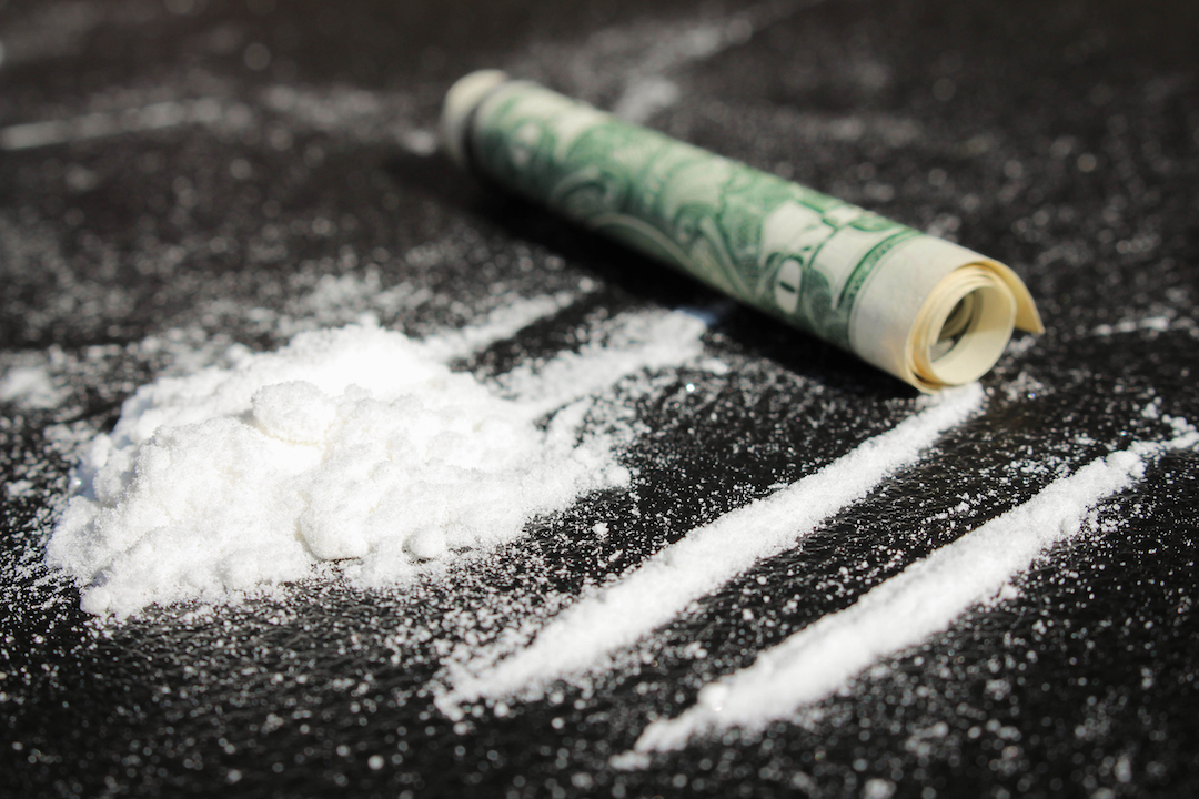 Lines of cocaine and one dollar bill