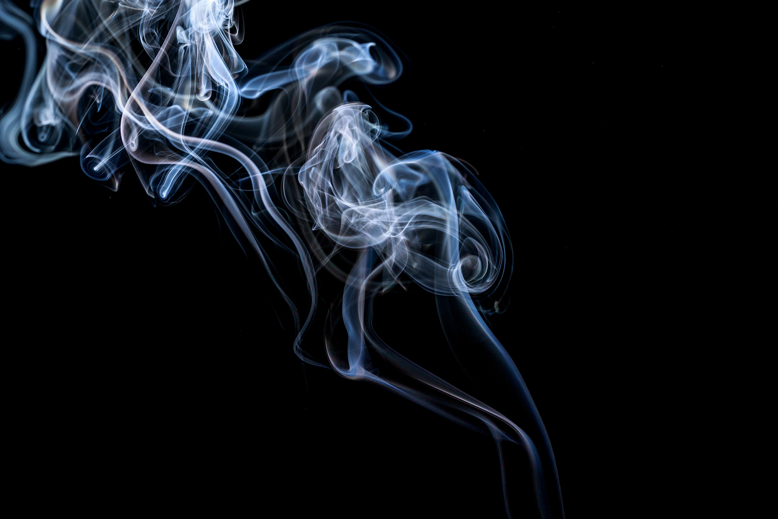 Abstract Smoke On A Black Background.